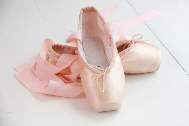 pair of dainty pink ballet shoes